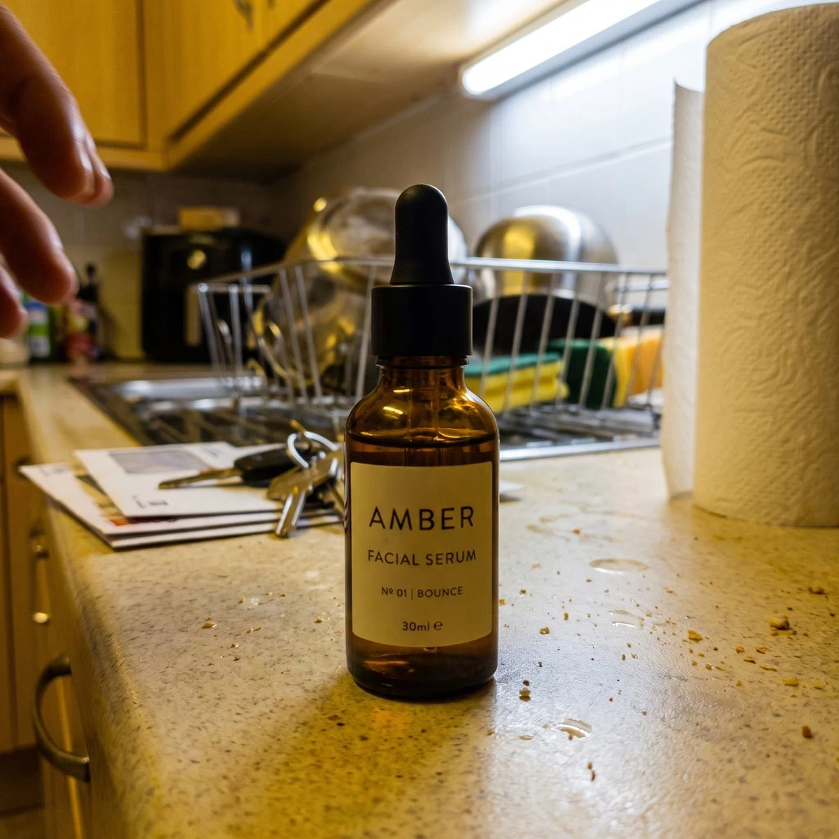 Original phone snapshot of the same serum bottle