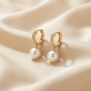 Elegant pearl earrings on silk