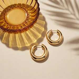 Gold hoops on textured fabric