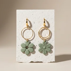 Artisanal floral earrings on paper