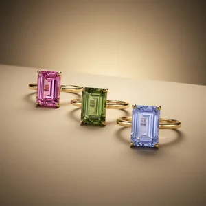 Colorful gemstone rings on gold
