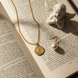 Vintage charm necklace on book