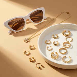 Chic gold jewelry and sunglasses