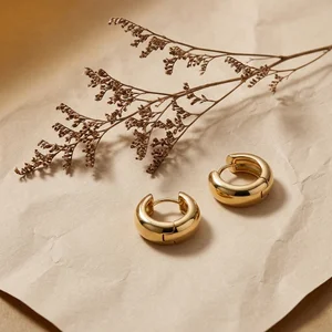 Gold hoops on textured paper
