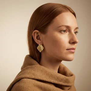 Luxury gold geometric earring on model