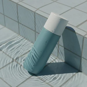 Refreshing blue spray bottle in water