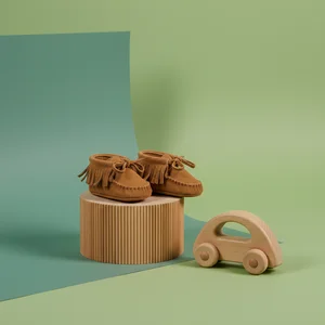 Adorable baby shoes and toy