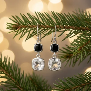 Festive earrings on pine branch