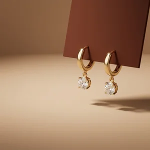 Elegant gold diamond earrings on card