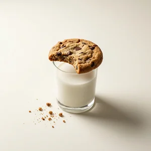 Bitten cookie on milk glass