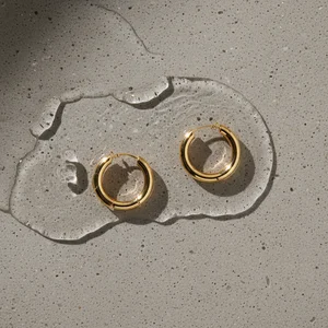 Gold bangles on concrete