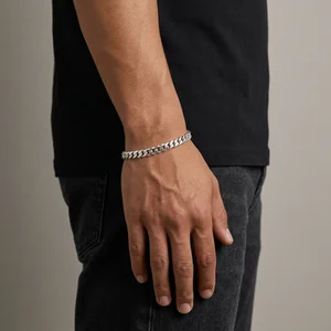 Men's silver chain bracelet on wrist