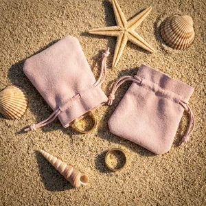 Summer jewelry bags on sand