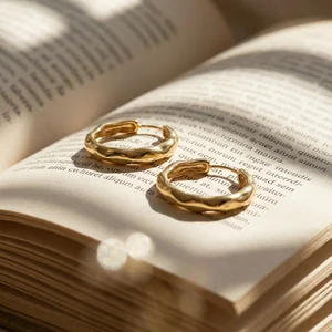 Gold hoops on open book