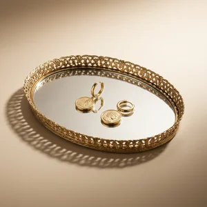 Vintage gold earrings on mirror
