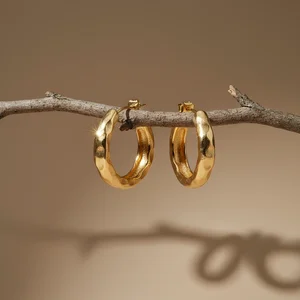 Artisan gold bangles on branch