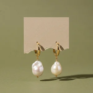 Modern pearl earrings on kraft card