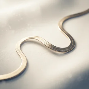Elegant gold chain on draped silk