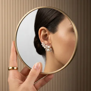 Pearl earring reflection in mirror