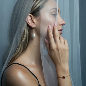 Elegant jewelry behind sheer fabric