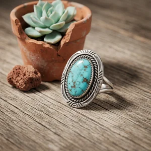 Artisanal turquoise ring on wood