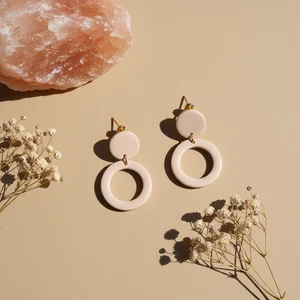 Luxury gold earrings on marble