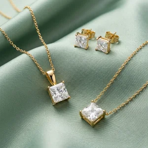 Elegant gold jewelry on teal silk