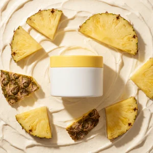 Pineapple skincare cream flat lay