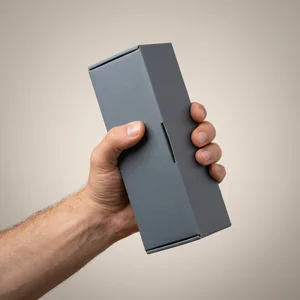 Hand holding dark gray box