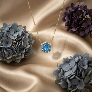 Elegant blue gem necklace on satin