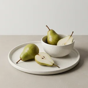 Fresh pears in ceramic bowl