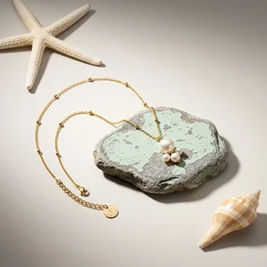 Pearl necklace on weathered stone