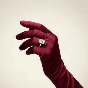 Diamond ring on burgundy satin glove