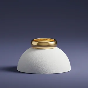 Gold ring on concrete pedestal