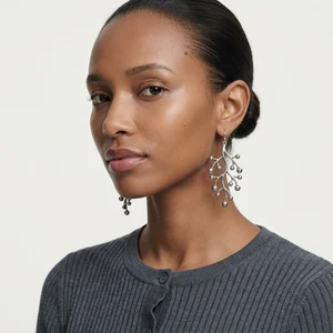 Model wearing branch earrings
