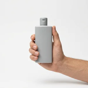 Minimalist hand-held bottle mockup
