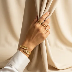 Elegant gold jewelry on draped fabric