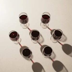 Wine glasses, dramatic shadows