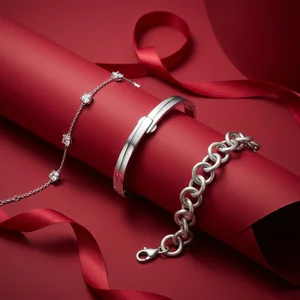 Elegant silver bracelets on red