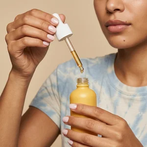 Applying facial oil close-up