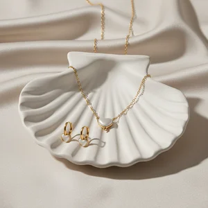 Elegant gold jewelry on seashell