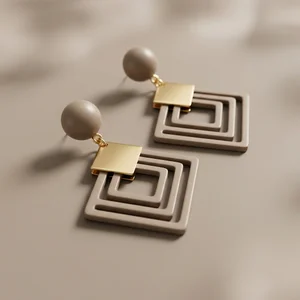 Modern geometric earrings on beige