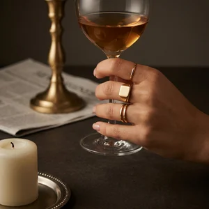 Chic gold rings and dark nails