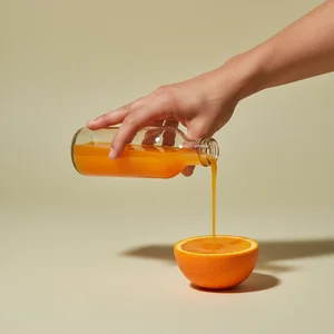 Refreshing orange juice pour