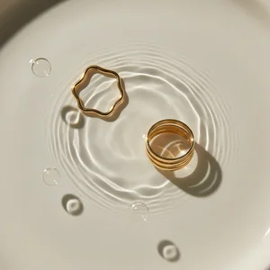 Golden jewelry in rippling water