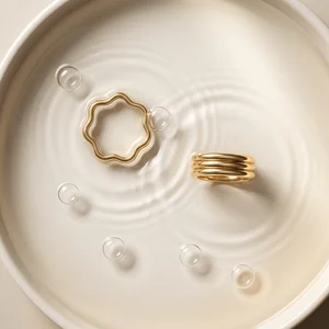 Minimalist gold rings in water
