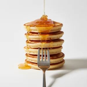 Golden pancakes with syrup
