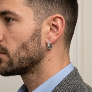 Men's silver hoop earring on model