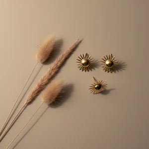 Minimalist gold accessories with pampas