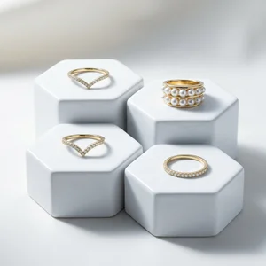 Elegant gold rings on white pedestals
